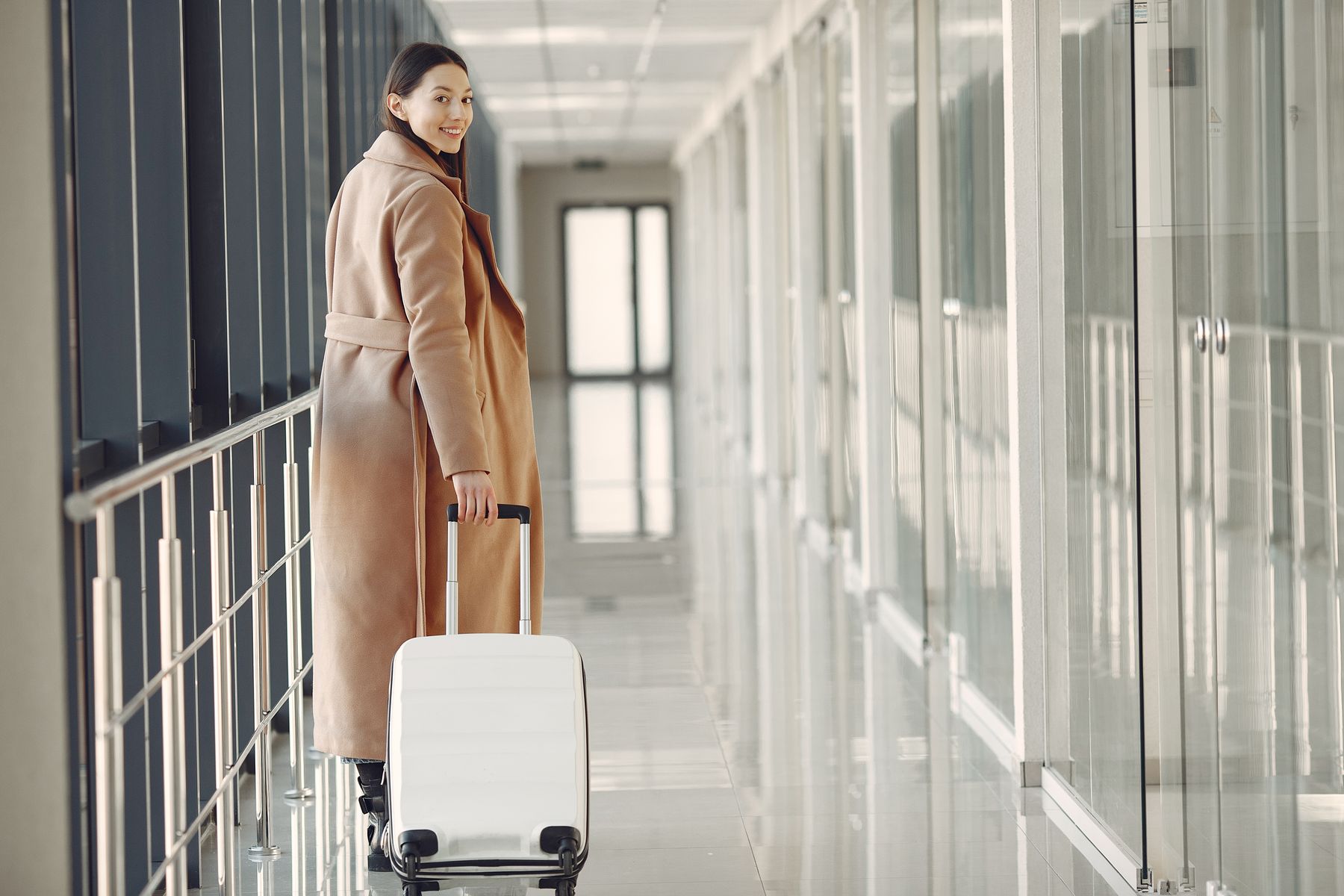 Traveler with a rolling suitcase, ready for her trip to Turkey